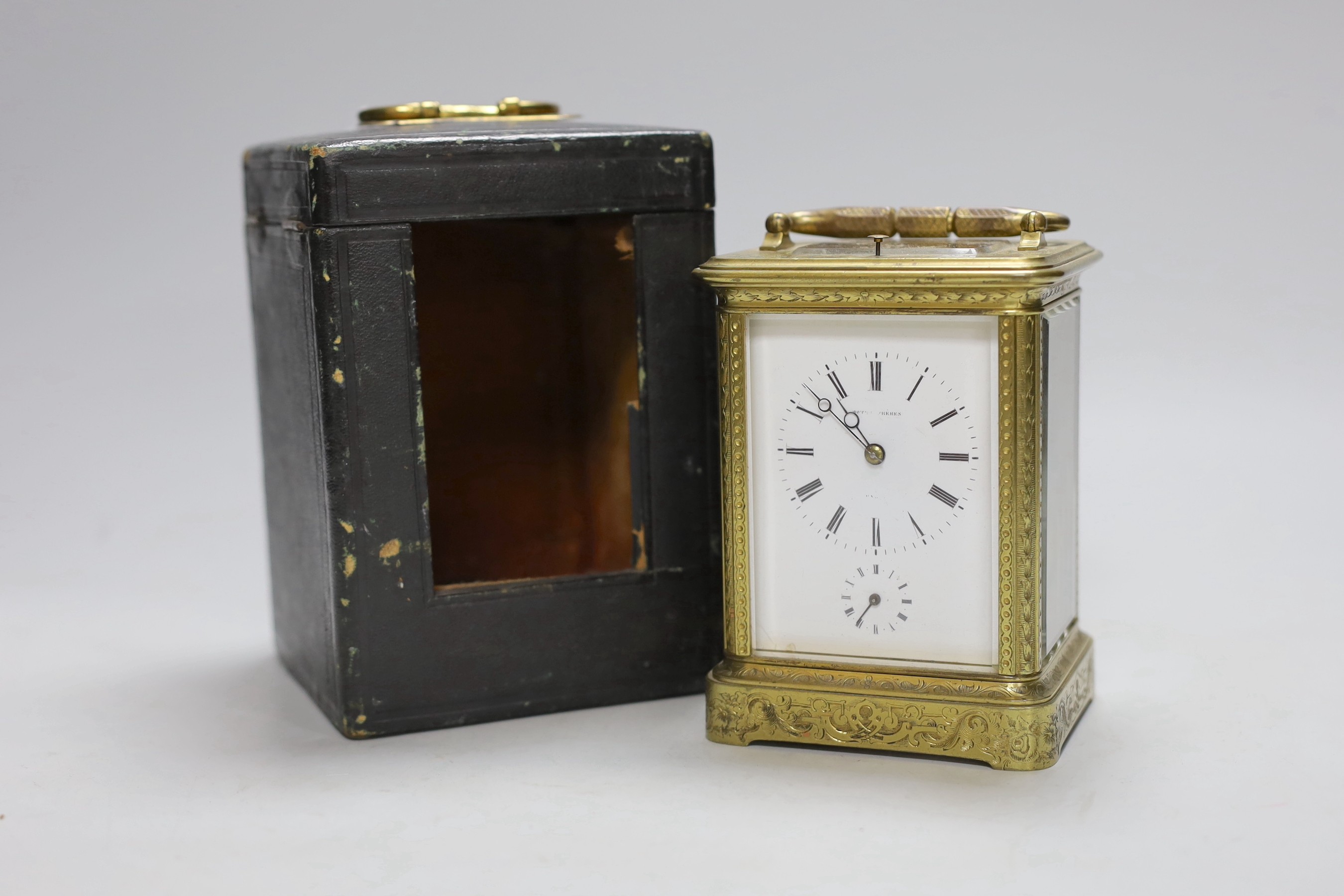 A late 19th century French engraved brass repeating carriage clock with alarm, signed Mottu Freres, Paris, 13cm high